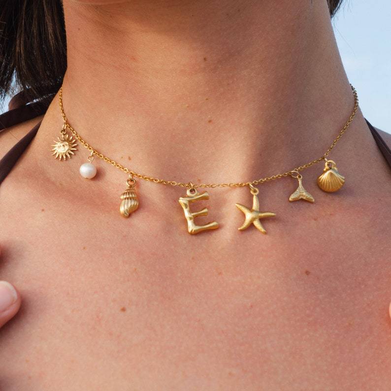 European & American Ocean Series Necklace for Women – Titanium Steel with Pearl, Shell & Saturn Elements