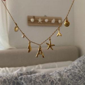 European & American Ocean Series Necklace for Women – Titanium Steel with Pearl, Shell & Saturn Elements